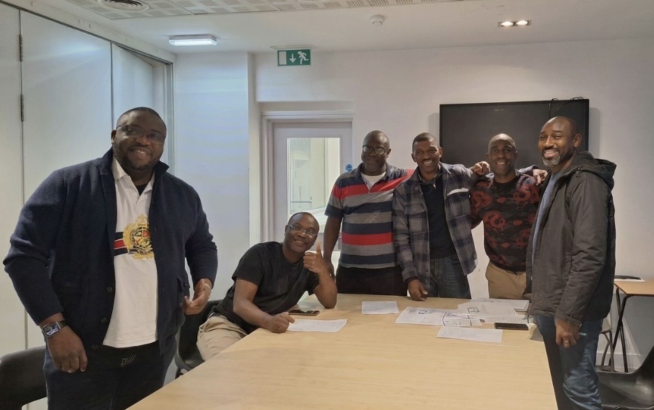 Sparks Youth Initiative founders gathered around a table during the mental awareness programme that sparked the initiative.